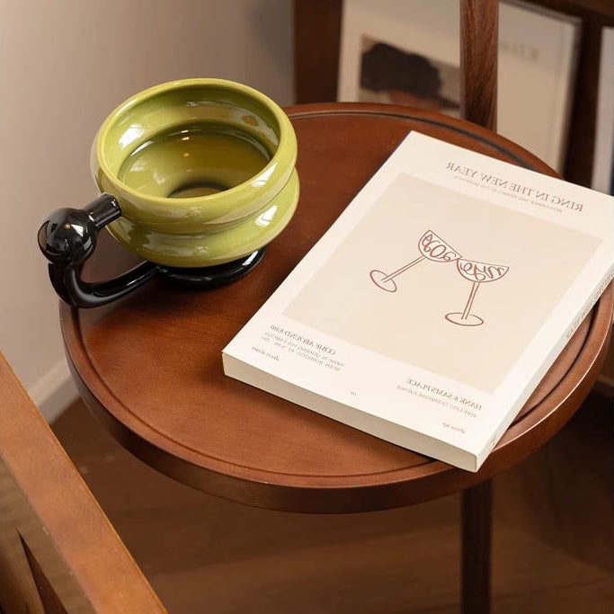 Close-up of the side table paired with the Coby Arc Floor Lamp Double Mushroom Shade.