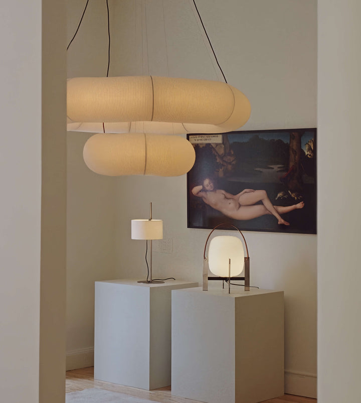 Modern interior with pendant lights,artwork on a wall and Alix Cesta Metálica Basket Lamp with chrome legs and frosted glass