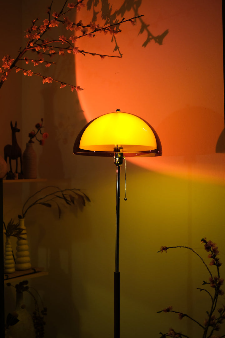 Coby+ Mushroom Bauhaus Floor Lamp Orange with Pull Chain against a warm-toned wall with decorative elements.