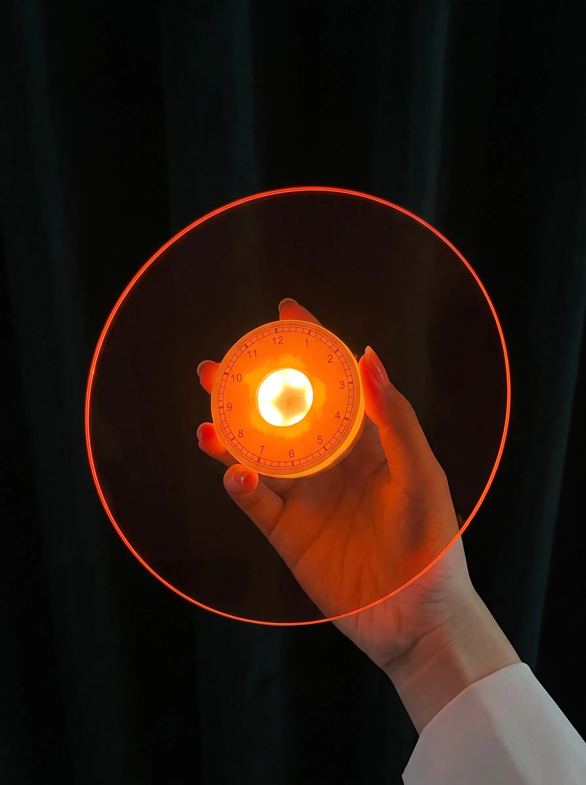 Handheld retro rechargeable lamp with amber glow and orange circular shield