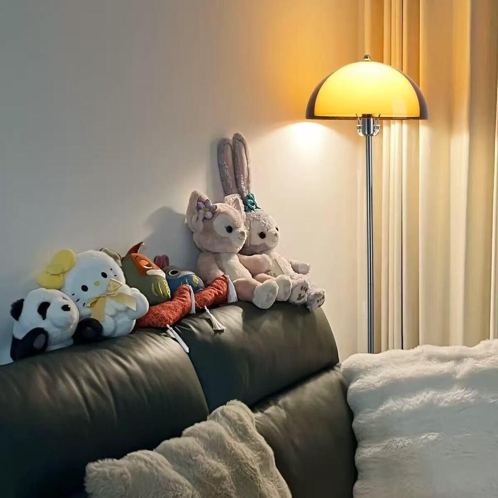 The coby floor lamp placed beside the bed in the bedroom is very cozy and unique.